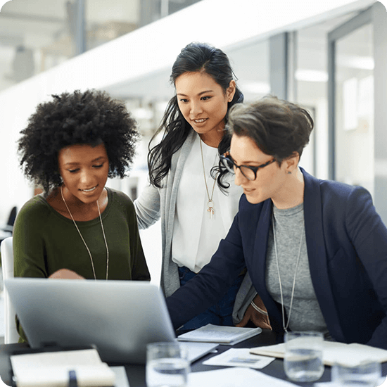 Employees gathered around a laptop